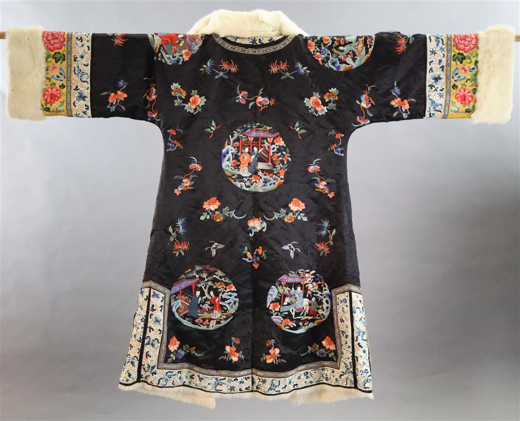 A Chinese silk embroidered winter robe, late 19th century/early 20th century, length 125cm